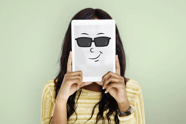 Woman Covering Face with Digital Tablet.