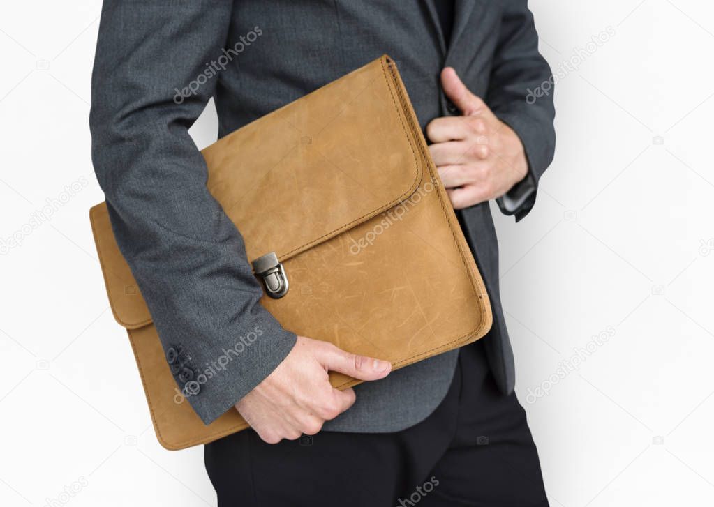 Businessman holding brown bag