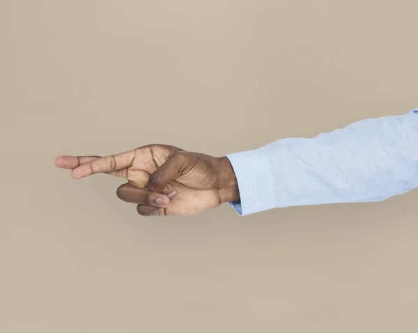 Mano humana mostrando dedos cruzados — Foto de Stock