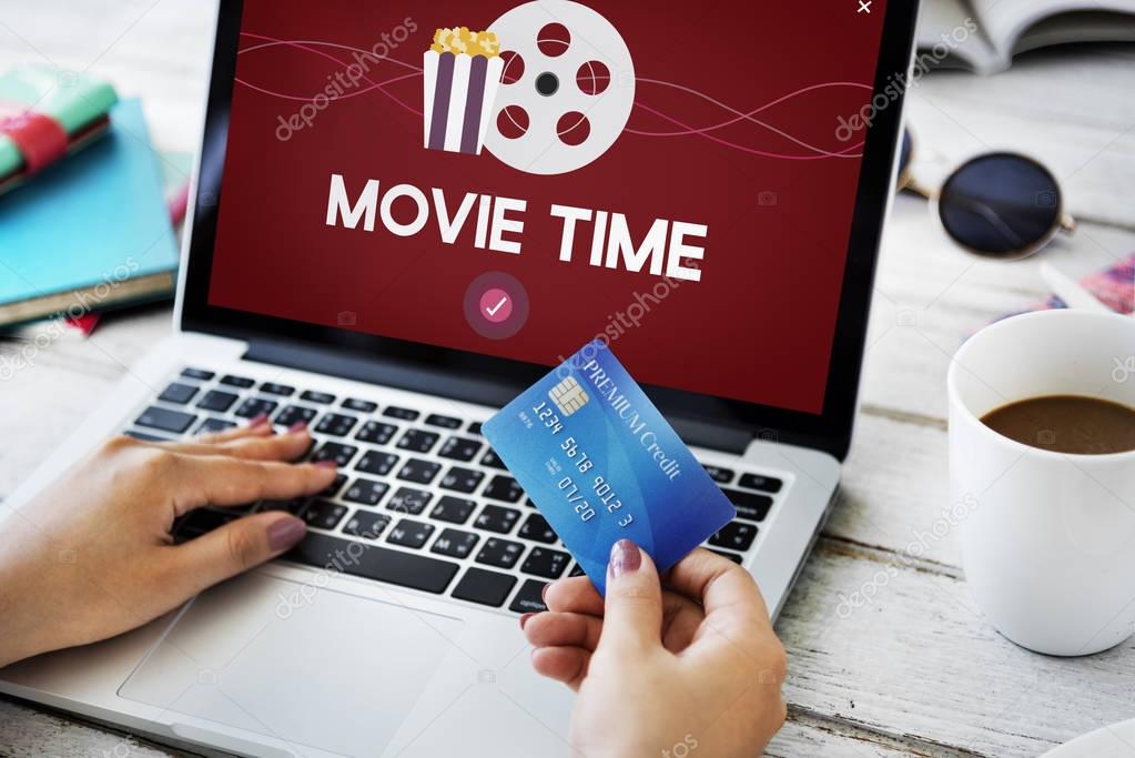 Woman with laptop and credit card. online payment Concept. Concept Movie Time