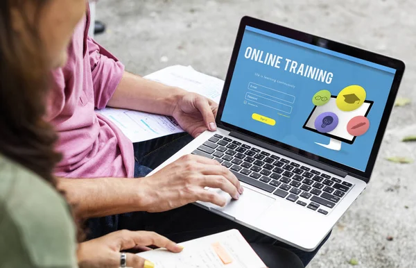 Students using laptop together — Stock Photo, Image