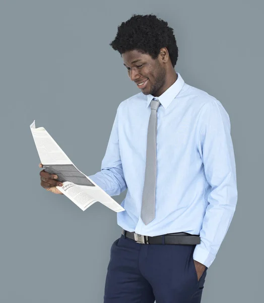 Businessman reading newspaper — Stock Photo, Image