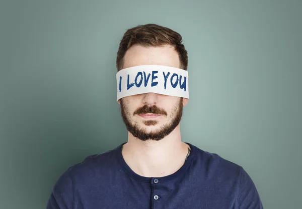 Man met overdekte ogen. — Stockfoto