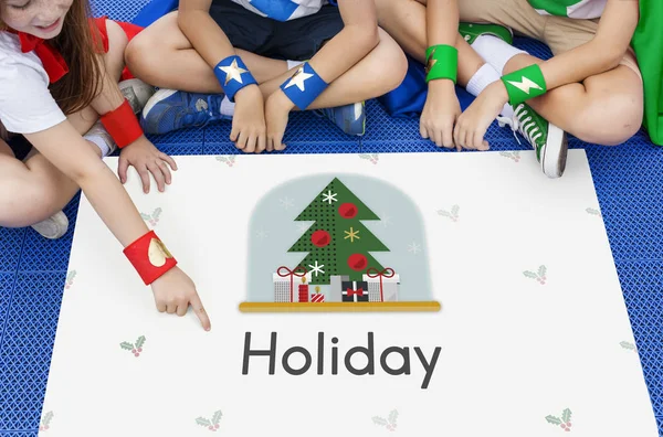 Superheroes kids sitting on floor with poster — Stock Photo, Image