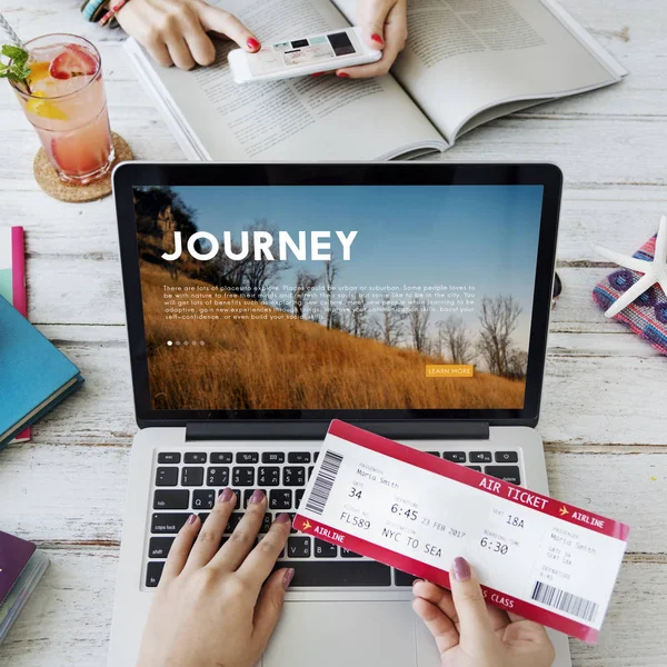 Woman with laptop and air ticket. — Stock Photo, Image