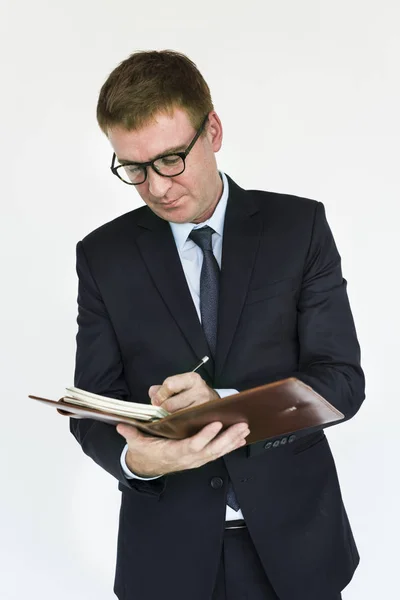 Hombre de negocios escribiendo en cuaderno —  Fotos de Stock