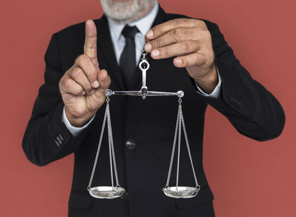 Businessman holding scale