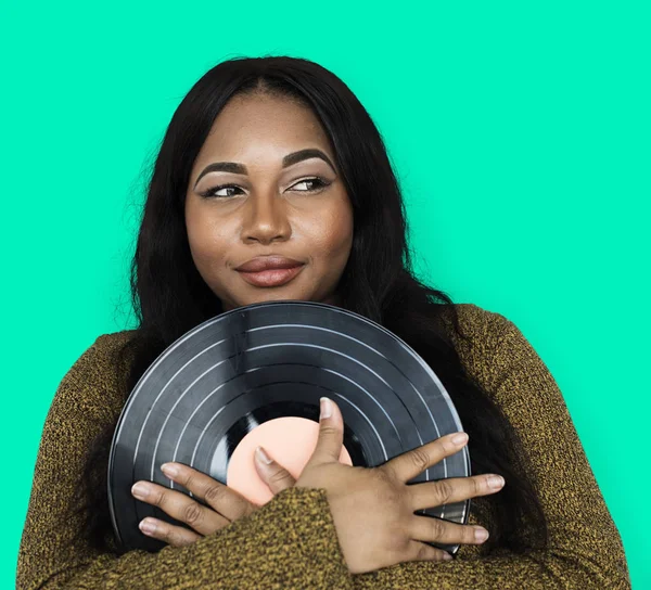 Mujer sosteniendo disco de vinilo —  Fotos de Stock