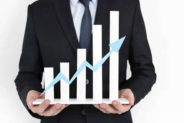 Businessman holding business chart model — Stock Photo, Image