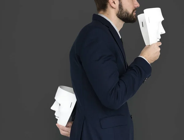 businessman holding masks