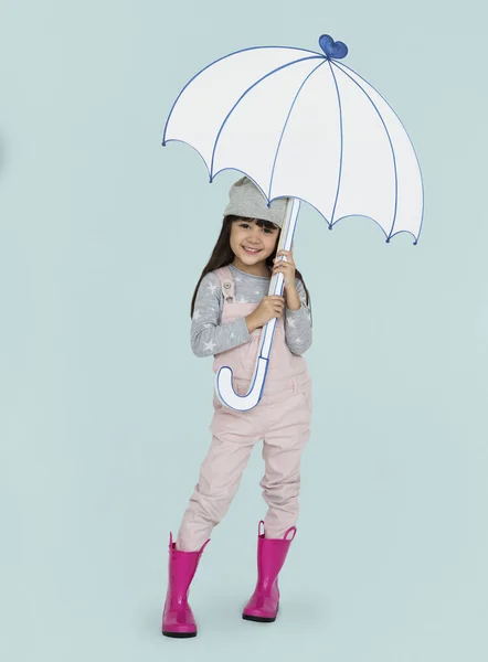 Menina segurando guarda-chuva falso — Fotografia de Stock