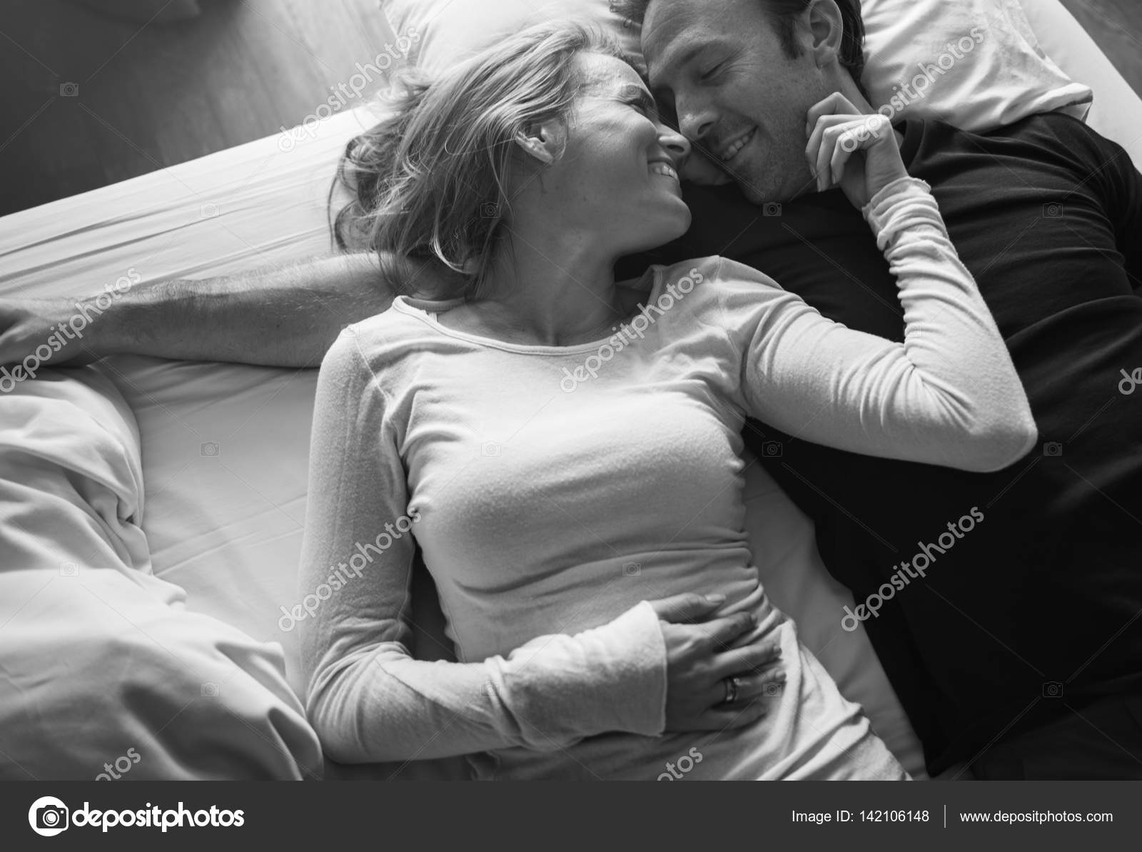 Couple lying in bad and hugging Stock Photo by ©Rawpixel 142106148