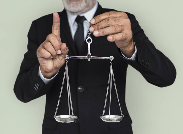 Businessman holding scale