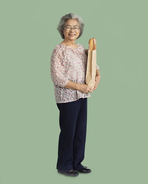 Woman holding bread — Stock Photo, Image