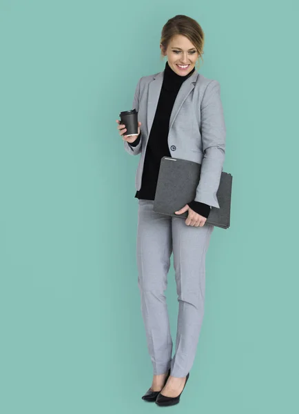 Businesswoman holding folder and coffee — Stock Photo, Image