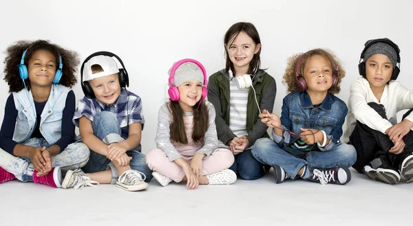 Group of children with headphones — Stock Photo, Image