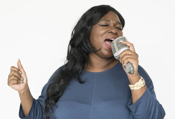 Happy African woman singing — Stock Photo, Image