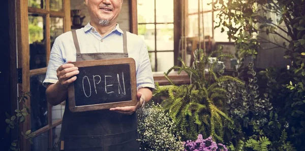 Waiter with open sign — Stock Photo, Image