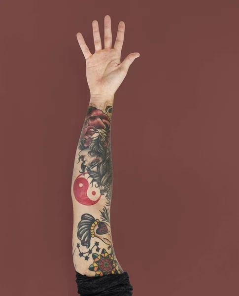 Hand in tattoos in the studio — Stock Photo, Image