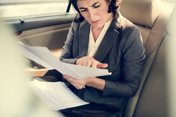 Businesswoman doing paperwork