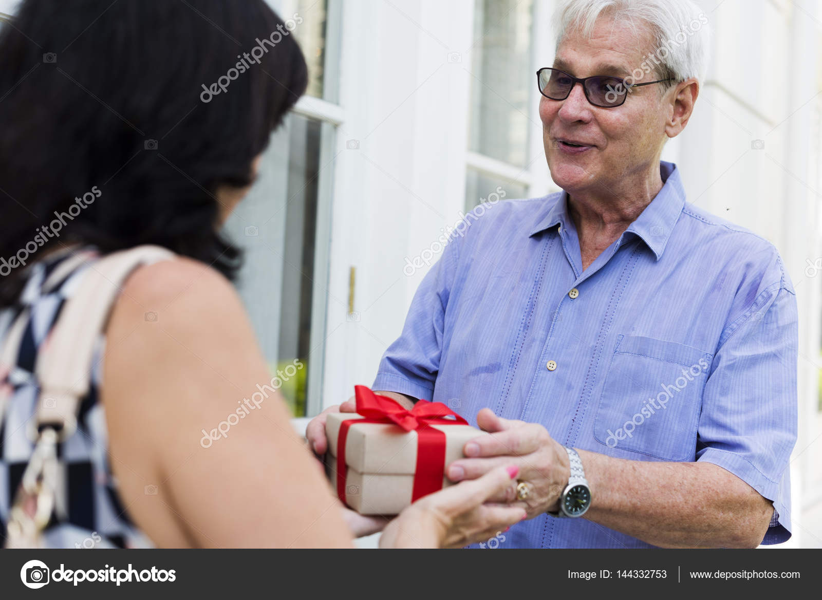 Husband giving present to wife — Stock Photo © Rawpixel 144332753
