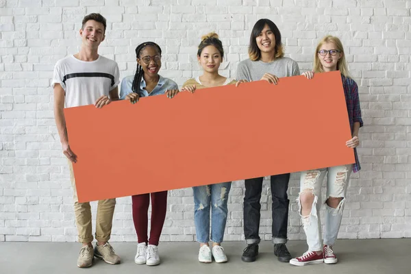 Young people holding banner — Stock Photo, Image