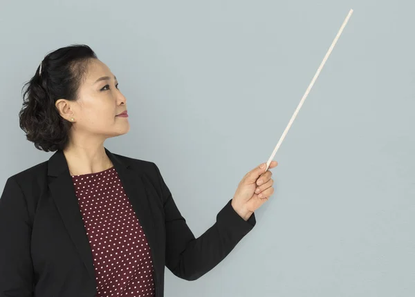 Businesswoman holding pointer — Stock Photo, Image