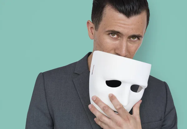 Empresário segurando máscara — Fotografia de Stock
