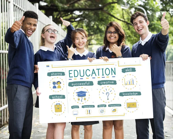Multiethnic students with poster — Stock Photo, Image