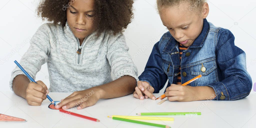 Happy kids drawing together