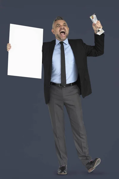 Businessman holding empty paper poster — Stock Photo, Image