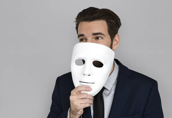businessman holding mask