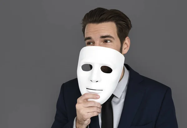 businessman holding mask