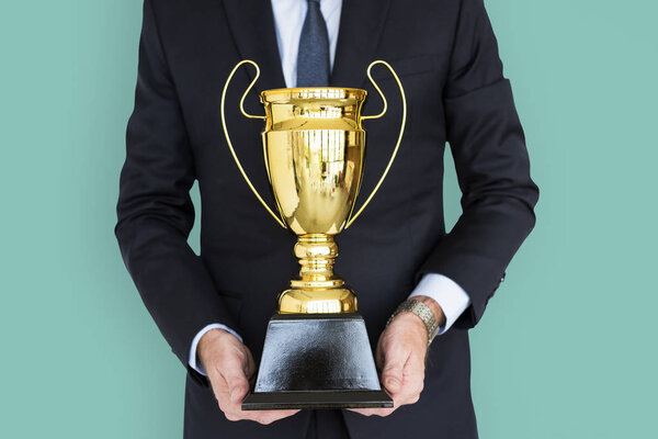 businessman Holding Trophy