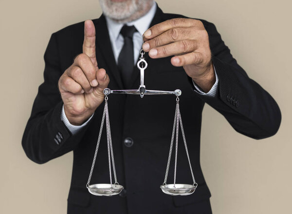 businessman holding Scales