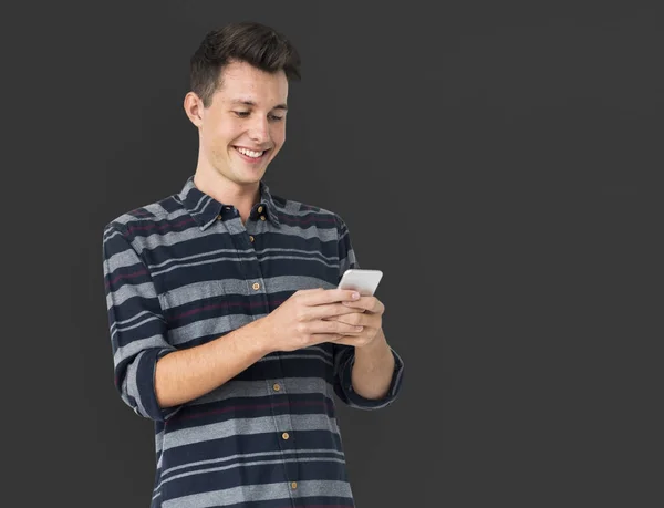 Young man using smartphone — Stock Photo, Image