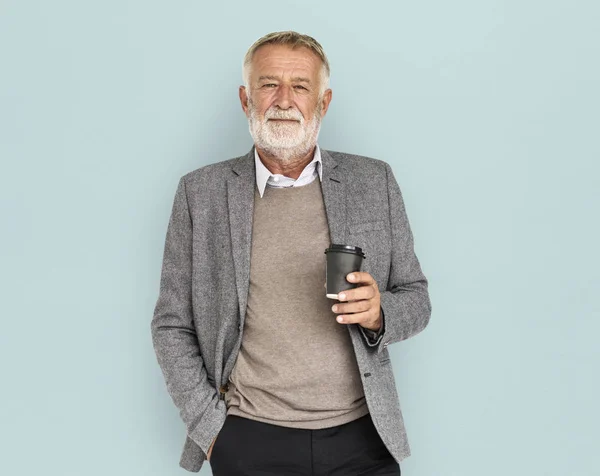 Anziano uomo d'affari con tazza di caffè — Foto Stock