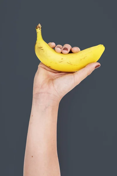 Banana a mano — Foto Stock