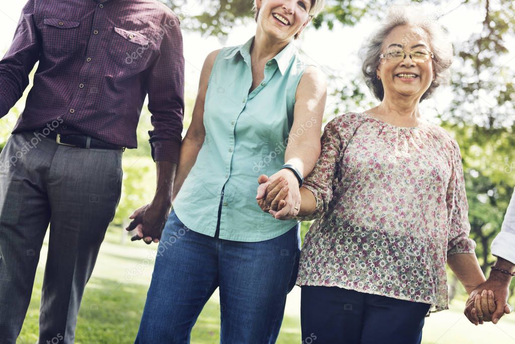 Senior Friends holding hands