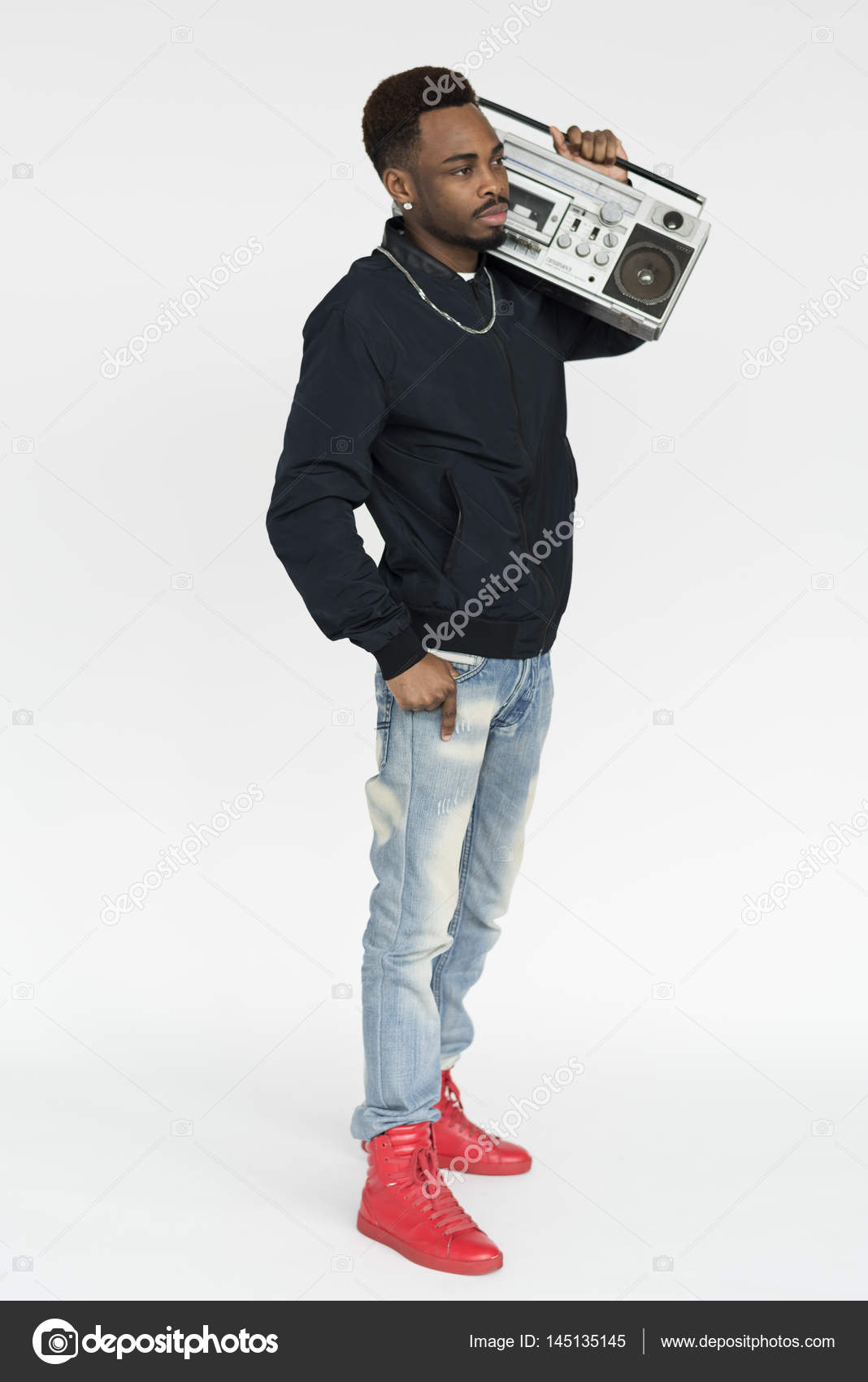 man holding boombox