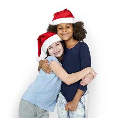 neşeli Noel Baba şapkaları çocuklarda