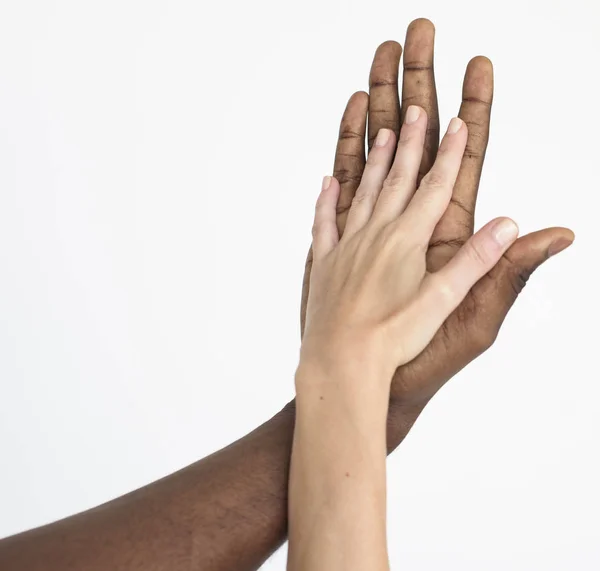 Multi ethnic arms holding together — Stock Photo, Image