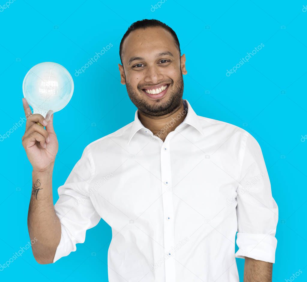 Indian businessman holding Light Bulb