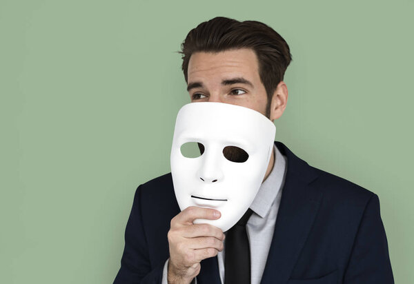 businessman holding mask