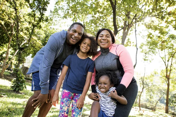 Happy family in park — Stock Photo, Image