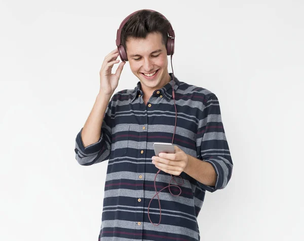 Man listening music in headphones — Stock Photo, Image