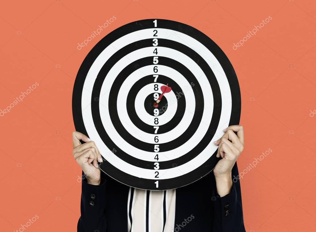woman holding darts