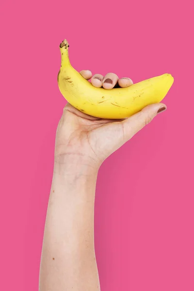 Dłoń banan gospodarstwa — Zdjęcie stockowe