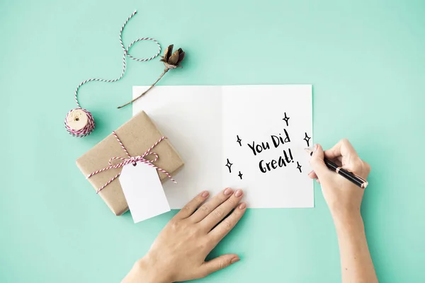 Person writing on greeting card — Stock Photo, Image