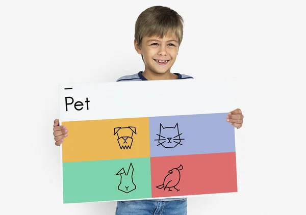 Boy holding placard — Stock Photo, Image